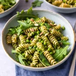 Pesto Pasta with Arugula, Asparagus, Peas, and Pistachios