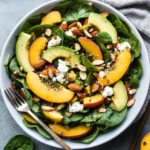 Summer Peach Spinach Salad with Avocado, Toasted Almonds + Goat Cheese